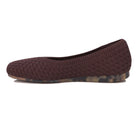 Brown woven flat shoe on a white background