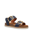 Navy blue sandal with gold buckles on a white background