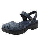 Blue sandal with perforated design on a white background
