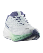 A Salomon running shoe in white and light purple with mint green accents, shown from a three-quarters angle on a white background.