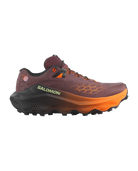 A Salomon trail running shoe in a dark plum-brown colorway with a bright orange midsole and orange accents, shown from a side profile on a white background.
