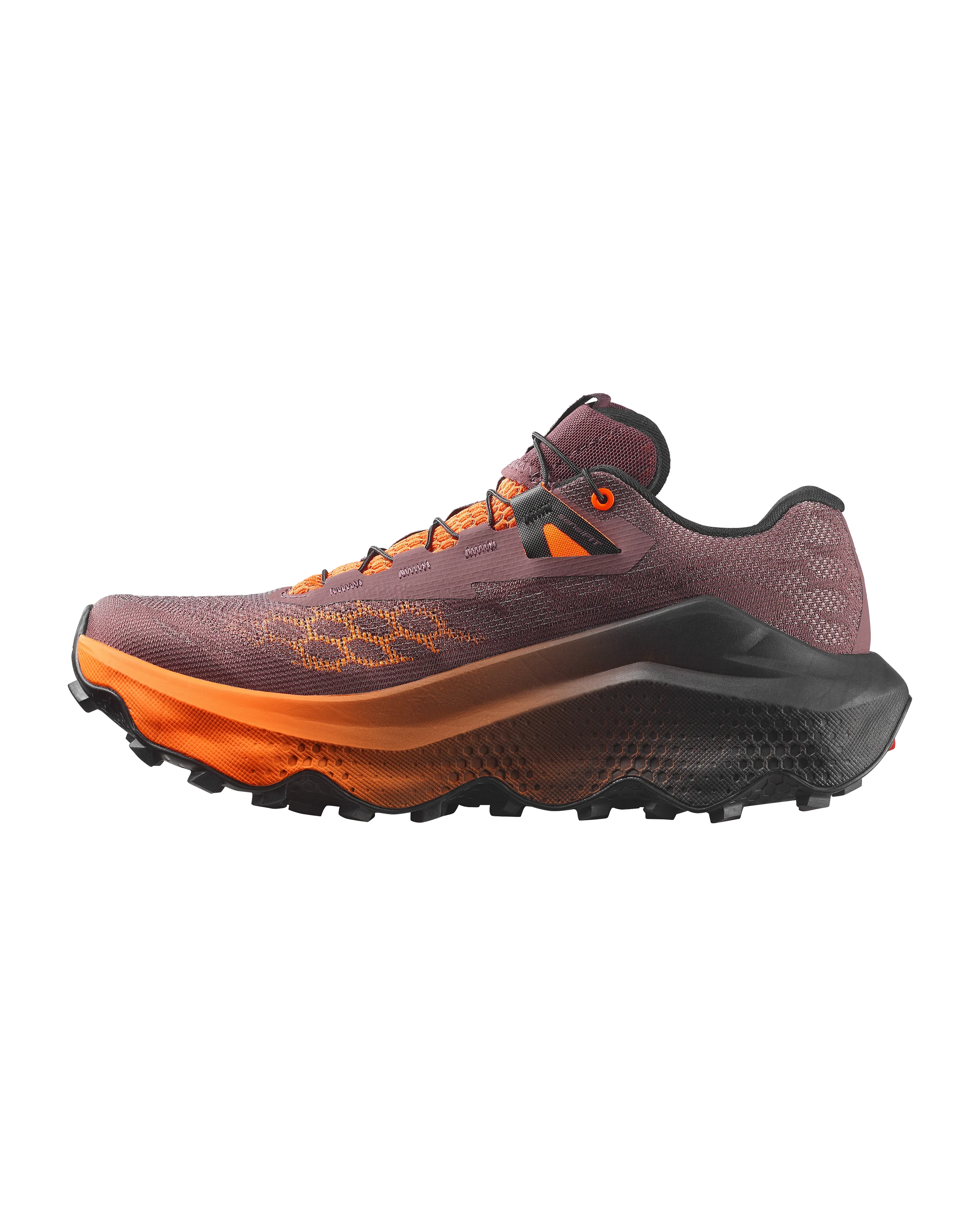 A trail running shoe shown in a side profile view against a solid white background. The shoe features a dark plum-purple mesh upper with orange geometric honeycomb patterns, a thick orange midsole, and a black and dark gray outsole.