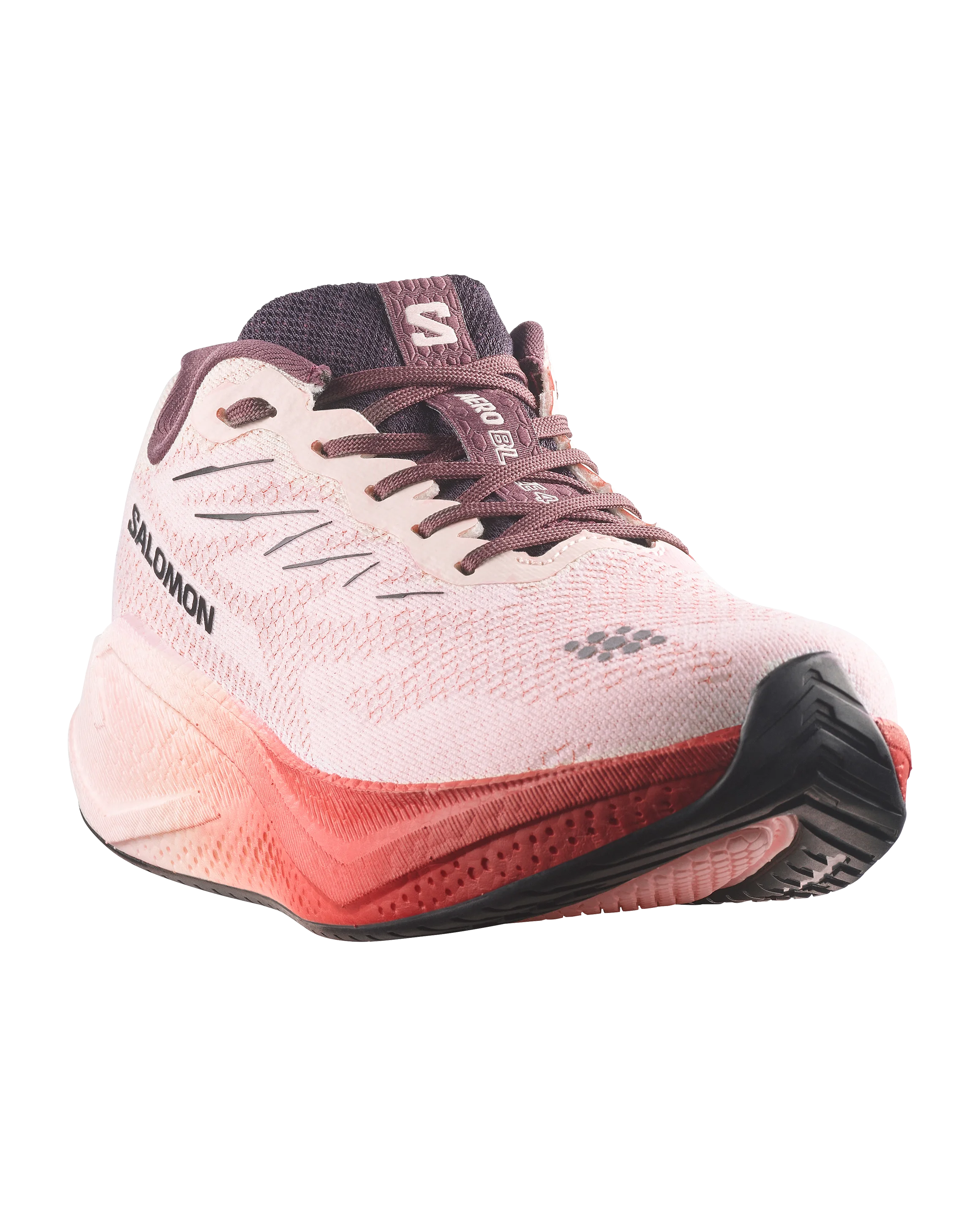 Salomon running shoe in light pink and coral red with dark purple accents, shown from a three-quarters angle on a white background.