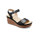 Black wedge sandal with cork sole on a white background