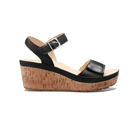 Black wedge sandal with cork sole on a white background