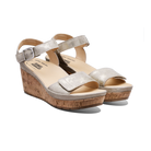 Silver wedge sandals with cork sole on a white background