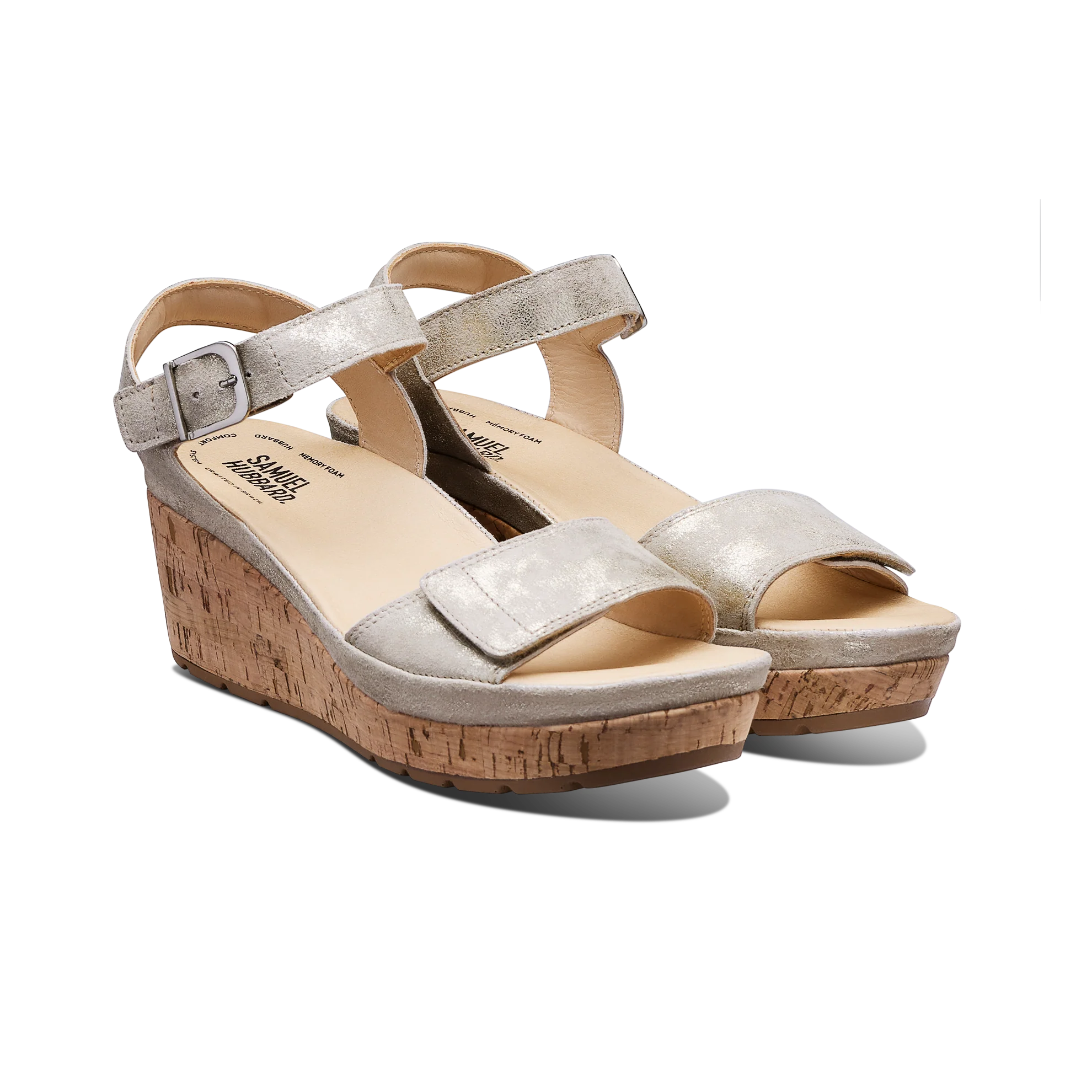 Silver wedge sandals with cork sole on a white background