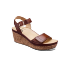 Brown wedge sandal with cork sole on a white background