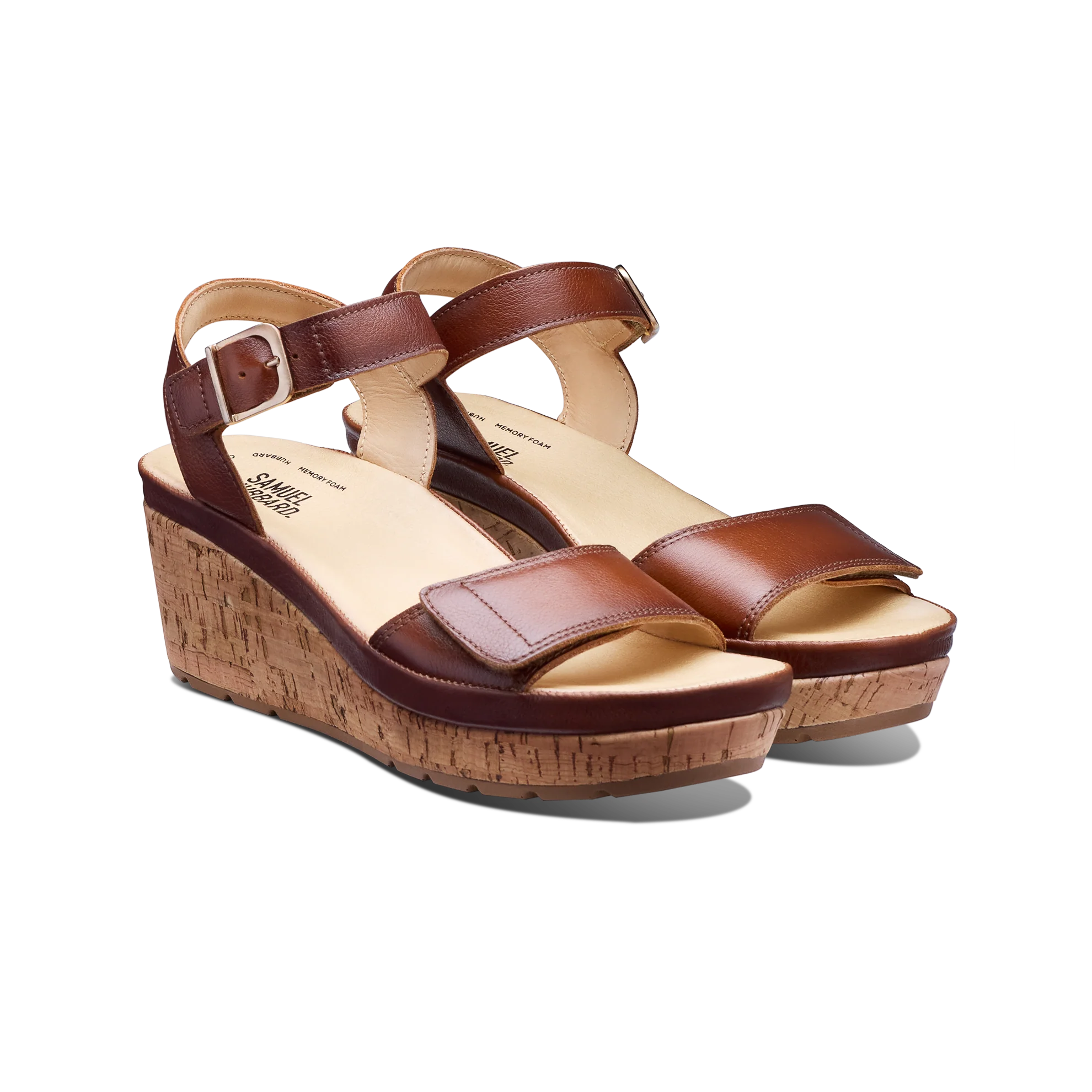 Brown wedge sandals with cork sole on a white background