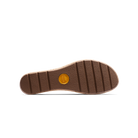Brown shoe sole with a yellow label on a white background