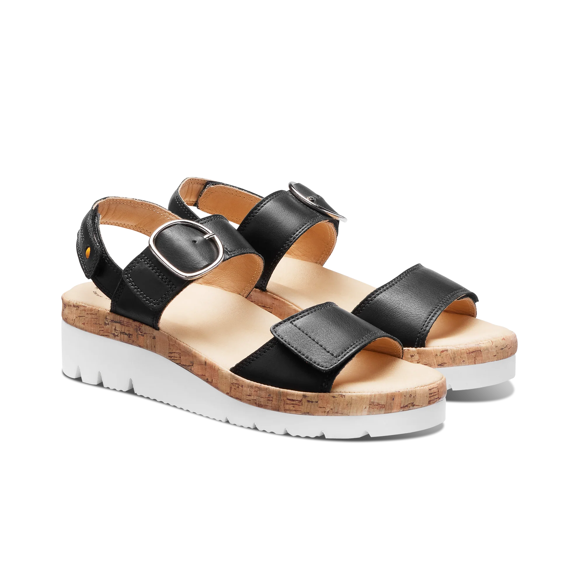 Black sandals with cork platform and white sole on a white background