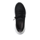 Black sneaker with white sole on a white background
