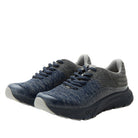Pair of blue athletic shoes on a white background