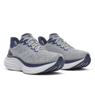 Pair of gray running shoes with blue accents on a white background