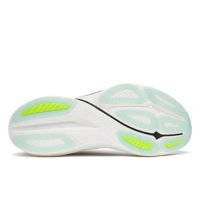 Close-up of a running shoe sole with green accents on a white background