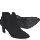 A pair of black suede ankle boots with kitten heels, with one boot showing the side profile and the other showing the treaded outsole. The brand name 'Sofi' is embossed on the sole.