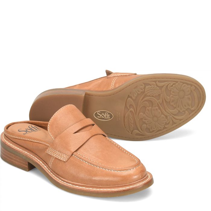 A pair of tan leather slip-on loafers shown on a white background, with one shoe standing upright and the other lying on its side to display the floral-patterned outsole.