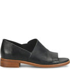 Black leather shoe with a brown sole on a white background