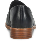 Black leather shoe with brown sole on a white background