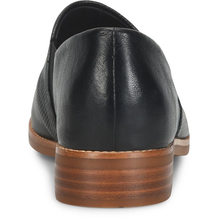 Black leather shoe with brown sole on a white background