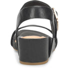 Black sandal with a strap and buckle on a white background