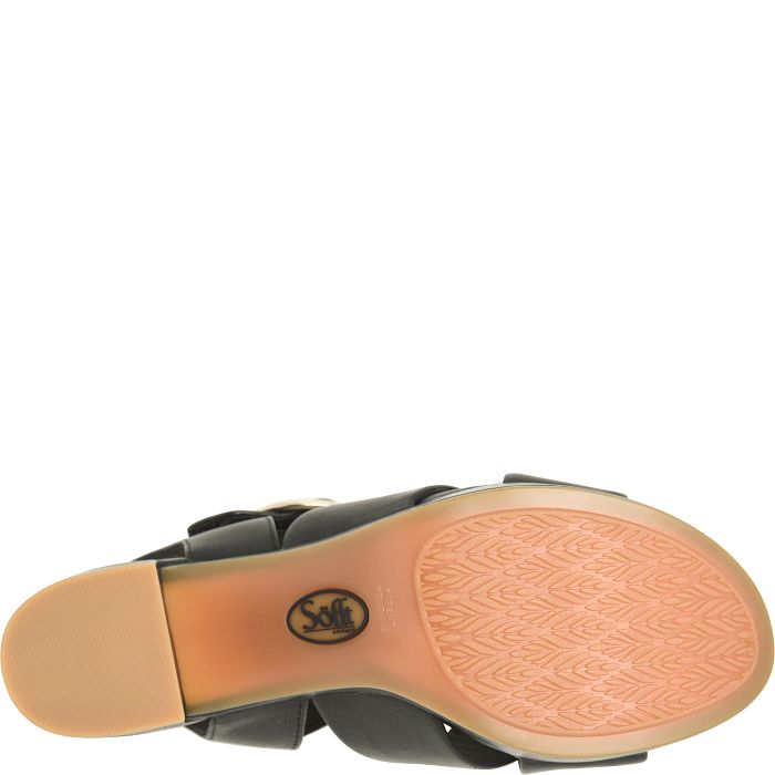 Close-up of a sandal sole with a visible brand logo on a white background