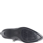 A close-up, top-down view of a black pointed-toe shoe sole, showing the tread pattern and a circular 'Soft' logo on the heel area, set against a plain white background.