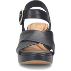 Black sandal with criss-cross straps on a white background