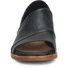 Black sandal with brown sole on a white background