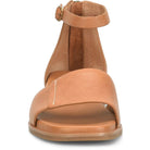 Tan sandal with a strap on a white background