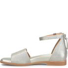 Silver sandal with a strap on a white background