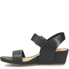 Black sandal with criss-cross straps on a white background
