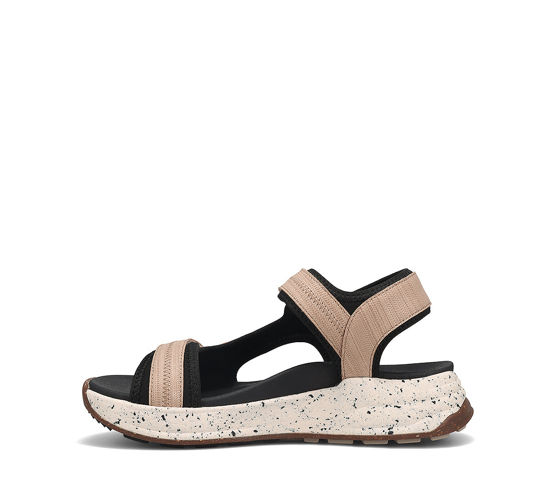 Beige and black sandal with a speckled sole on a white background