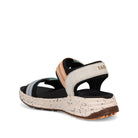 Sandal with speckled sole on a white background