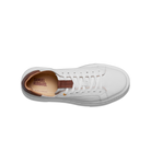 White sneaker with brown insole on a white background
