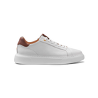 White sneaker with brown accents on a white background