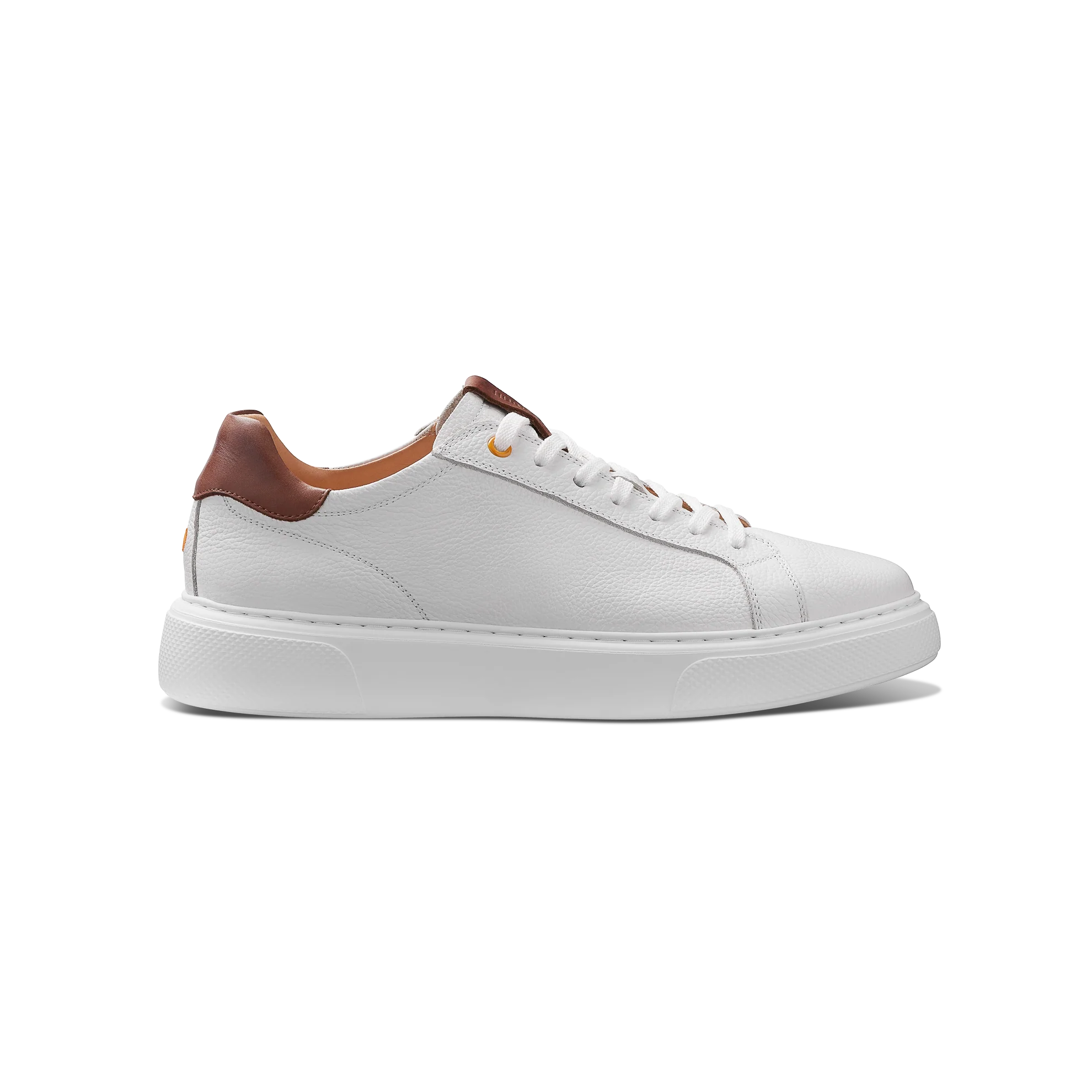 White sneaker with brown accents on a white background