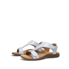 White sandals with brown soles on a white background