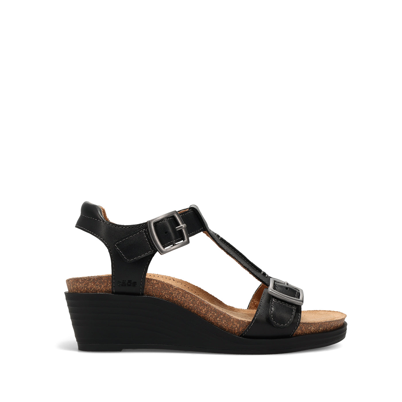 Black wedge sandal with cork insole on a white background
