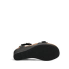 Black sandal with a strap on a white background