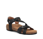 Black sandal with cork sole on a white background