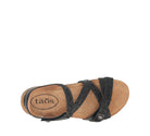 Tan sandal with black straps on a white background