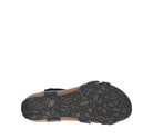 Black sandal sole with a pattern on a white background