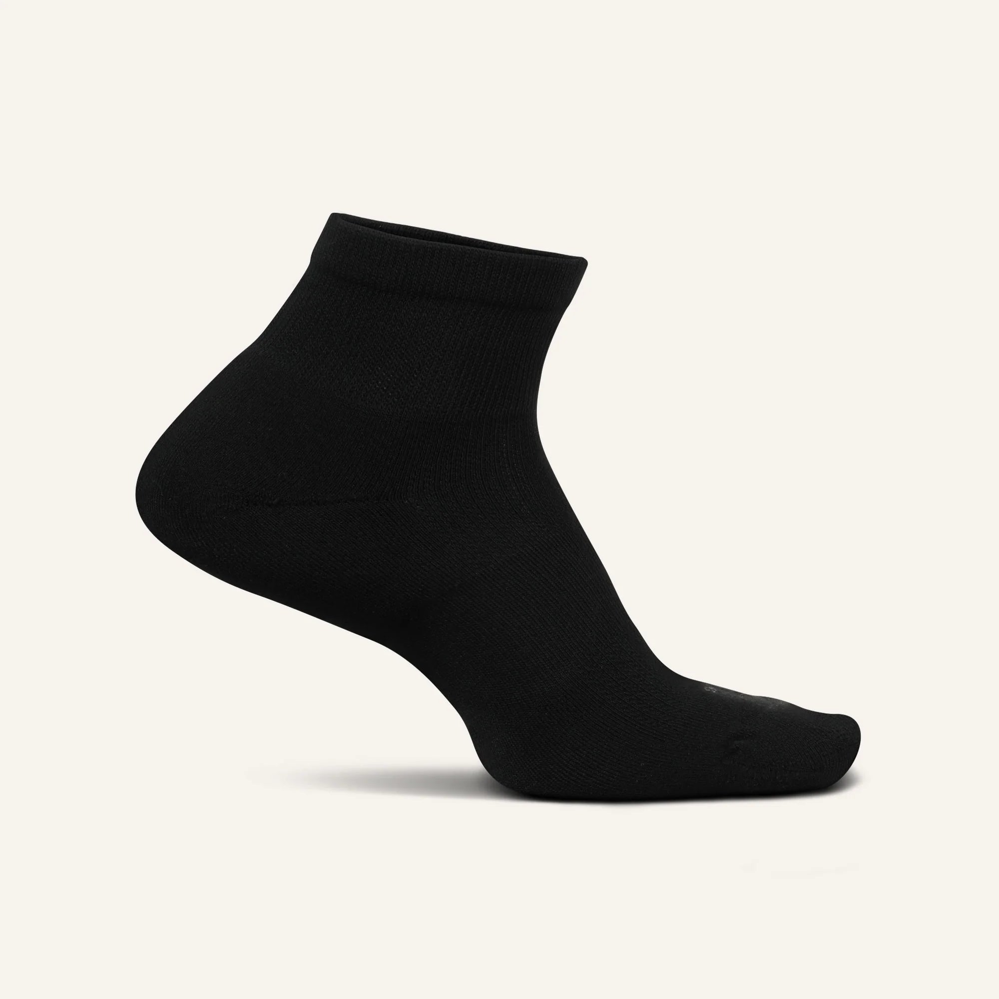 Black ankle sock on a light gray background