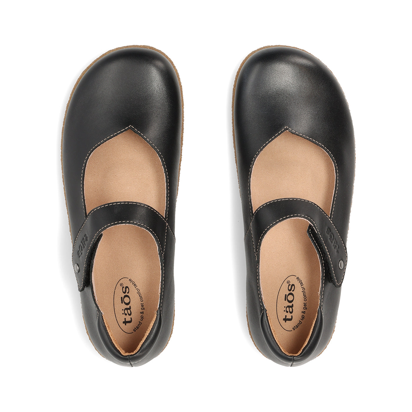 Pair of black leather shoes with a strap on a white background