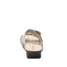 Black sandal with a gold buckle on a white background