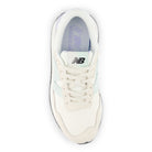 White sneaker with New Balance logo on a white background