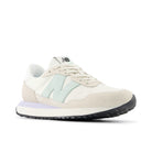 White sneaker with light blue accents on a white background