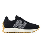 Black sneaker with a patterned 'N' on a white background