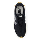 Black sneaker with New Balance logo on a white background